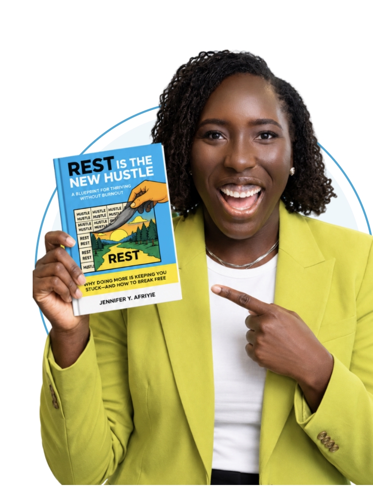 Jennifer Y. Afriyie holding her book, Rest Is the New Hustle